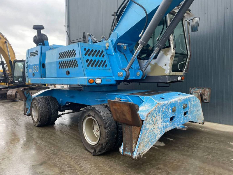 Umschlagbagger Für die Beförderung von Müll Fuchs MHL350: das Bild 7