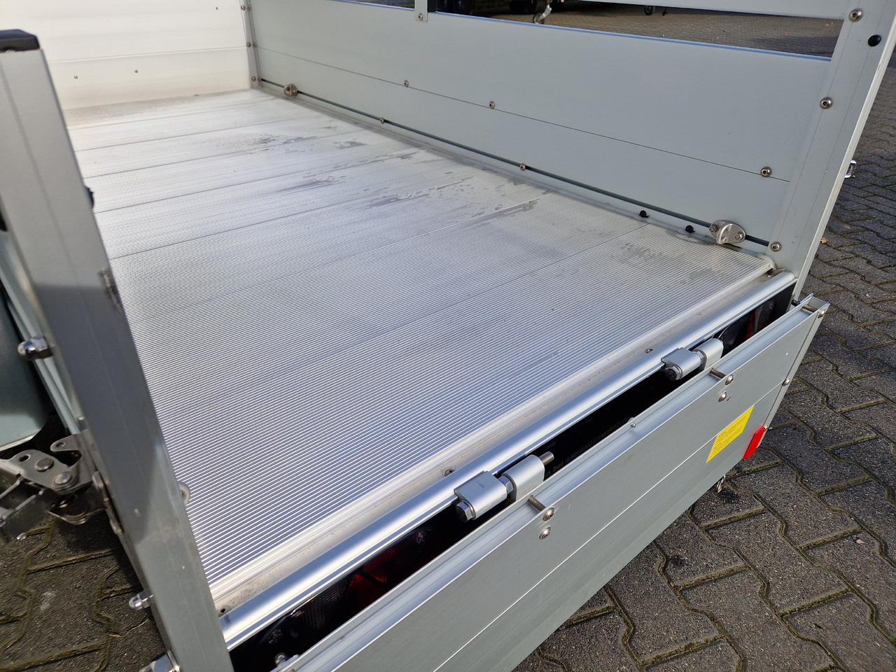 PKW Anhänger Koch Aluline+ B1000 205x105x40cm ALUBODEN (XS) 1000kg 100km/H Januar Online - PKW Anhänger: das Bild 5 PKW Anhänger Koch Aluline+ B1000 205x105x40cm ALUBODEN (XS) 1000kg 100km/H Januar Online - PKW Anhänger: das Bild 5