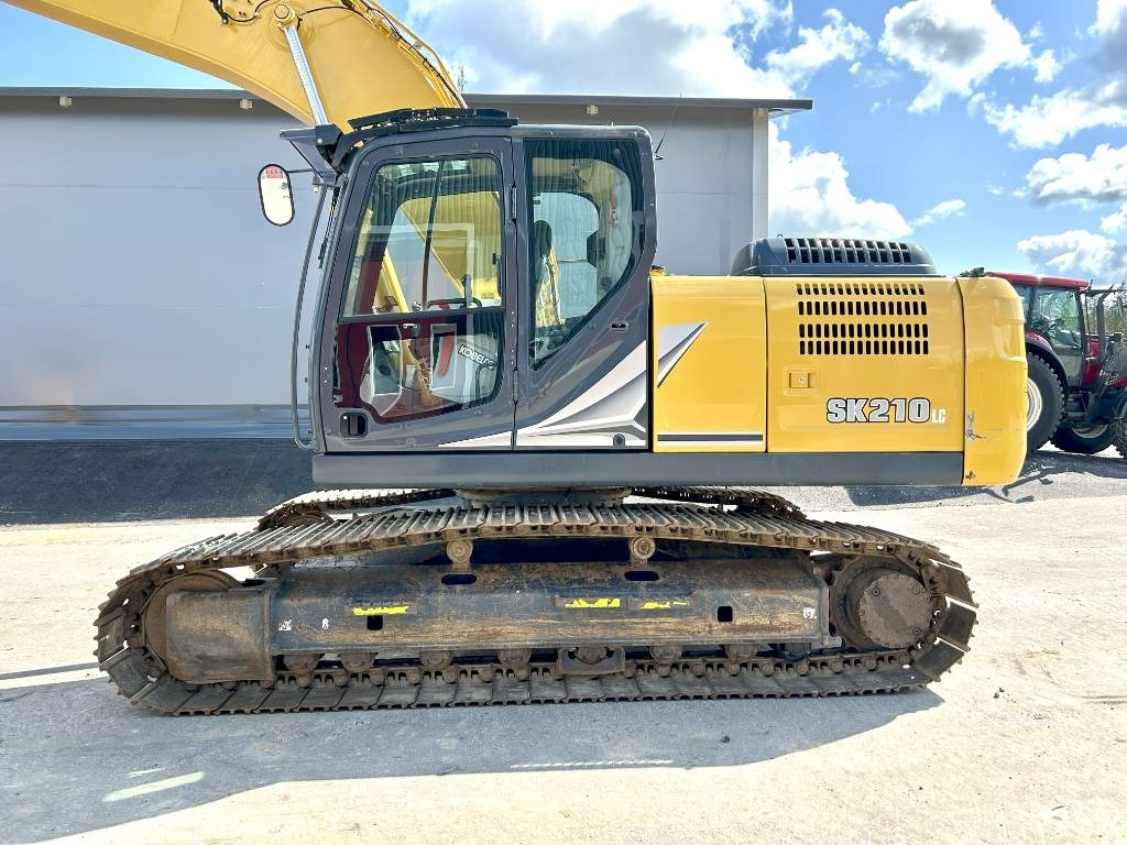 Kobelco SK210LC-11 PYÖRITTÄJÄLLÄ - Kettenbagger: das Bild 2 Kobelco SK210LC-11 PYÖRITTÄJÄLLÄ - Kettenbagger: das Bild 2