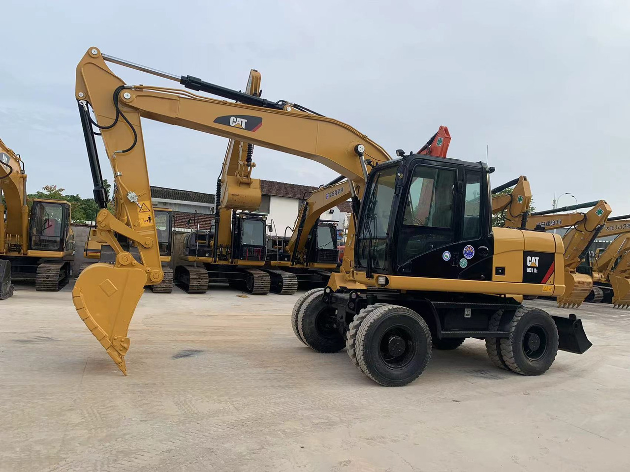Caterpillar M315D Wheel Excavator Moving by Tires - Mobilbagger: das Bild 2 Caterpillar M315D Wheel Excavator Moving by Tires - Mobilbagger: das Bild 2
