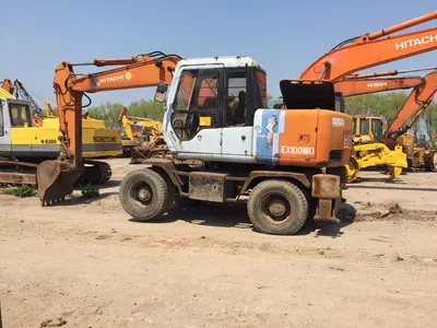 Original Color Tire Excavator Hitachi Ex100wd Ex160wd Moving by Wheels - Kettenbagger: das Bild 1 Original Color Tire Excavator Hitachi Ex100wd Ex160wd Moving by Wheels - Kettenbagger: das Bild 1