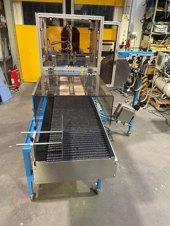 ATS Tanner UltraSonic US 2000-AB transit banding machine with pneumatic product hold-down and infeed roller table - Verpackungsmaschine: das Bild 4 ATS Tanner UltraSonic US 2000-AB transit banding machine with pneumatic product hold-down and infeed roller table - Verpackungsmaschine: das Bild 4