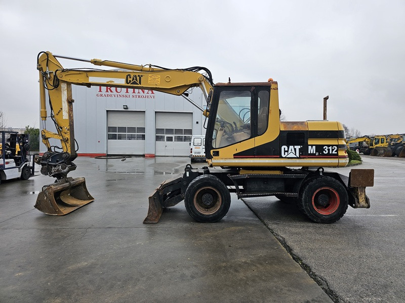 CATERPILLAR M312D - Mobilbagger: das Bild 1 CATERPILLAR M312D - Mobilbagger: das Bild 1