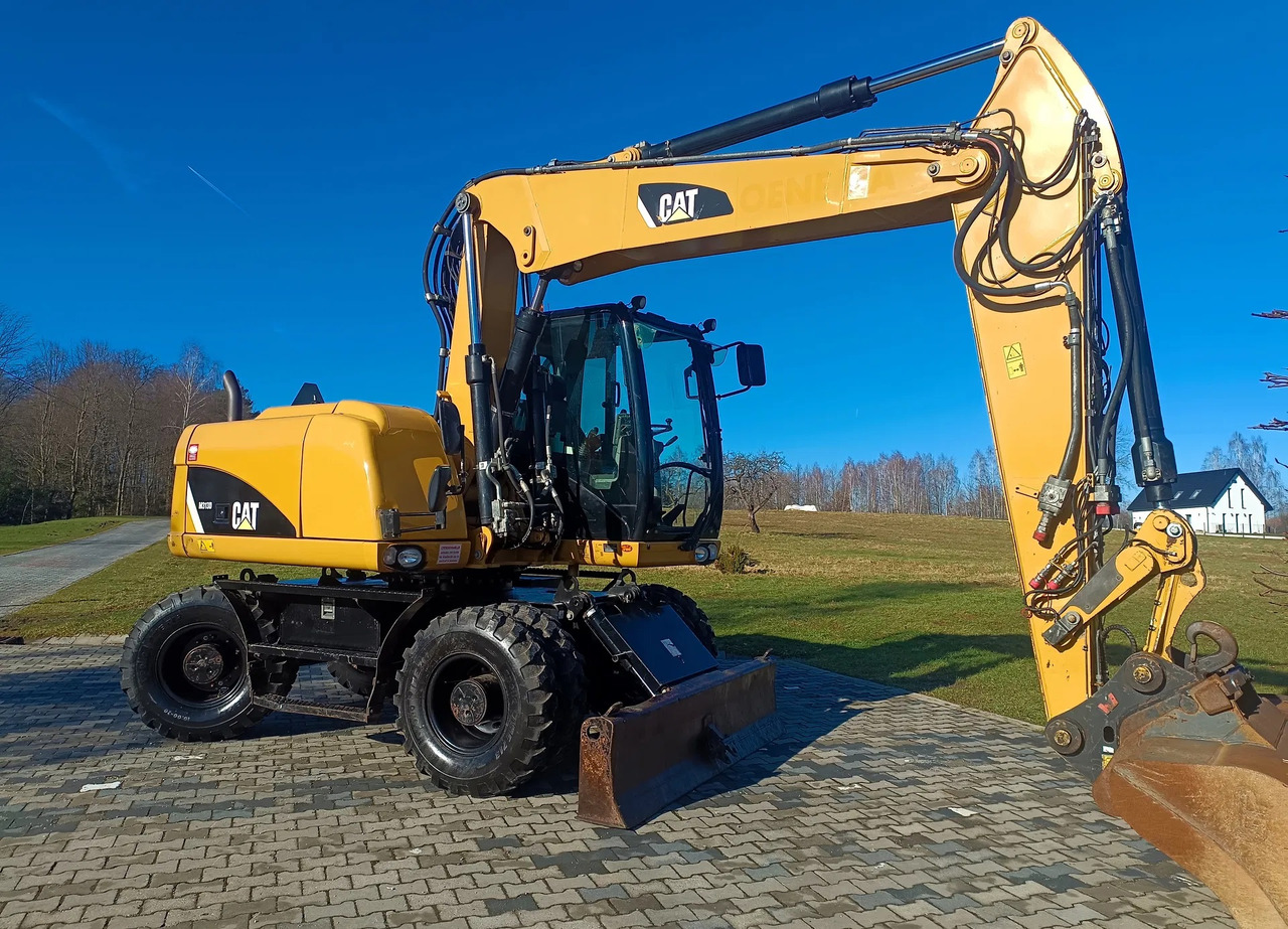 CATERPILLAR M313D - Mobilbagger: das Bild 2 CATERPILLAR M313D - Mobilbagger: das Bild 2
