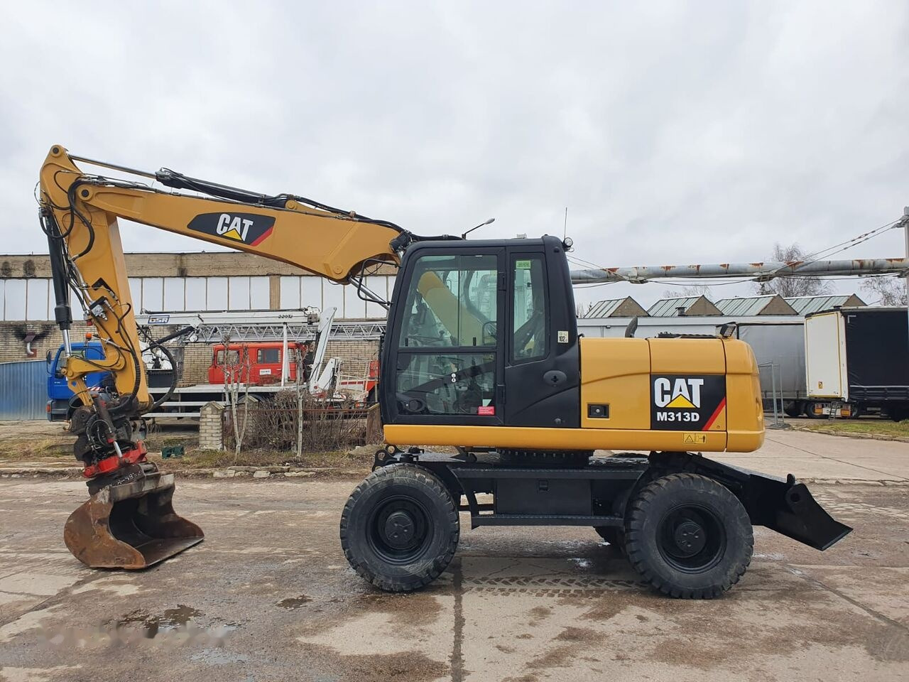 Caterpillar M 313 D Tiltrotator - Mobilbagger: das Bild 1 Caterpillar M 313 D Tiltrotator - Mobilbagger: das Bild 1