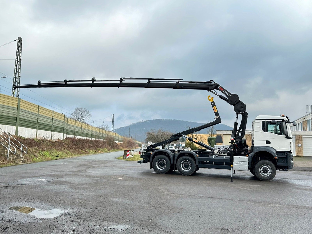 MAN TGS 33.440 6x6 BB Abrollkipper+Kran Hiab 228-6 - Abrollkipper, Autokran: das Bild 4 MAN TGS 33.440 6x6 BB Abrollkipper+Kran Hiab 228-6 - Abrollkipper, Autokran: das Bild 4