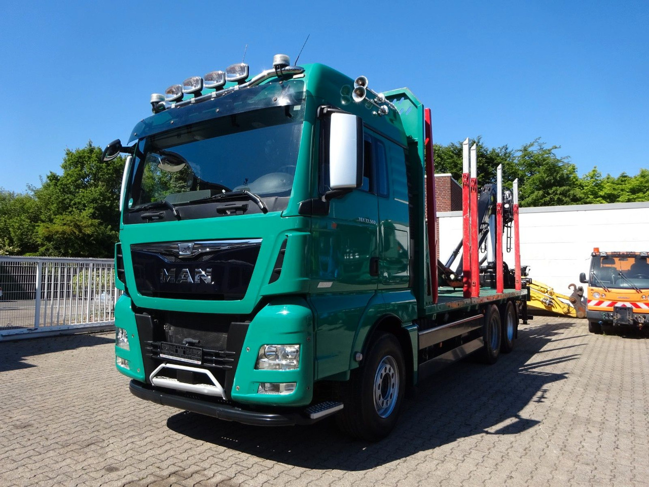 MAN 33.560 TGX mit TAJFUN L150Z Holzladekran 6x4 - Holztransporter, Autokran: das Bild 1 MAN 33.560 TGX mit TAJFUN L150Z Holzladekran 6x4 - Holztransporter, Autokran: das Bild 1