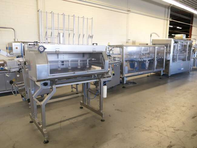 Tramper filling- and traysealing line GMD99-2 - Verpackungsmaschine: das Bild 1 Tramper filling- and traysealing line GMD99-2 - Verpackungsmaschine: das Bild 1