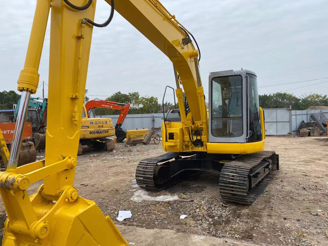 KOMATSU PC128US - Kettenbagger: das Bild 1 KOMATSU PC128US - Kettenbagger: das Bild 1