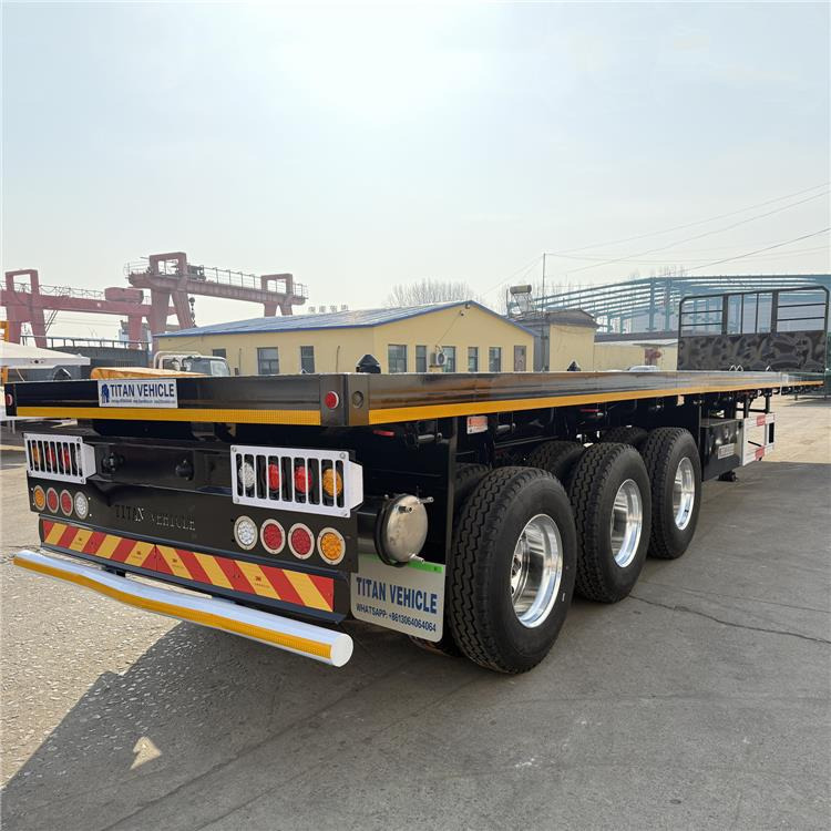 TITAN 12.5M 3 Axle Flat Deck Trailer for Sale In Tanzania - Container/ Wechselfahrgestell Auflieger: das Bild 1 TITAN 12.5M 3 Axle Flat Deck Trailer for Sale In Tanzania - Container/ Wechselfahrgestell Auflieger: das Bild 1